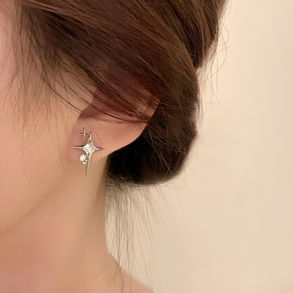 Star-shaped zirconia earrings with cross detail