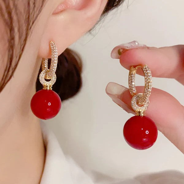 Pavé hoop earrings with ball pendants