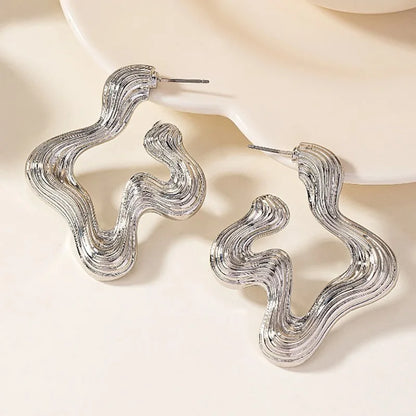 Sculptural wave statement earrings