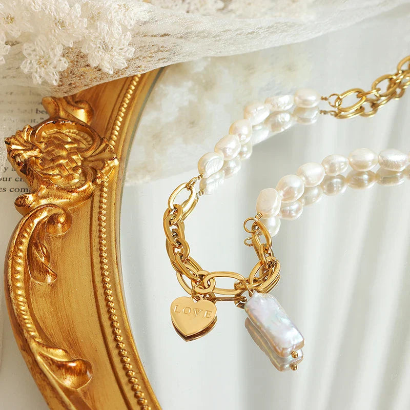 Pearl accent necklace with love pendant