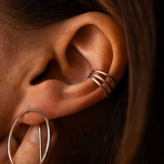 Spiral ear cuff with shiny surface