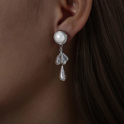 Pearl stud earrings with textured teardrop pendants